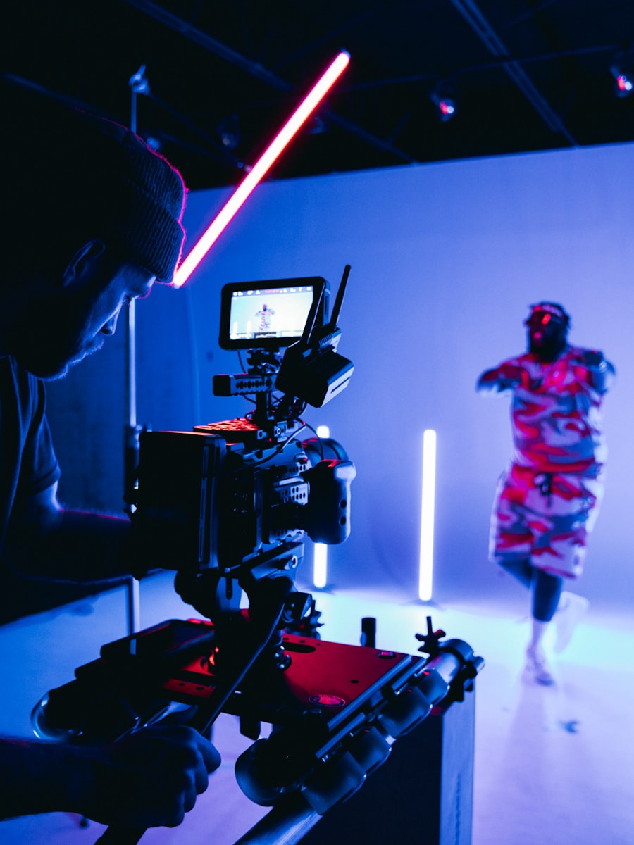 A camera rig filming a performer under coloured light.